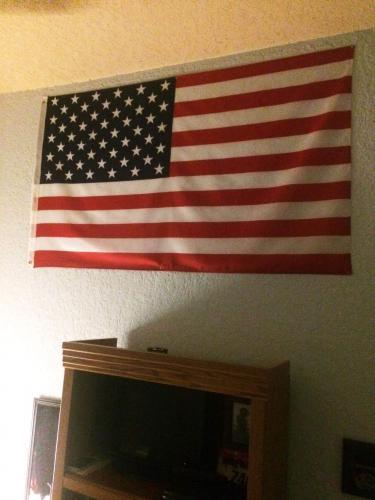 hanging american flag in room